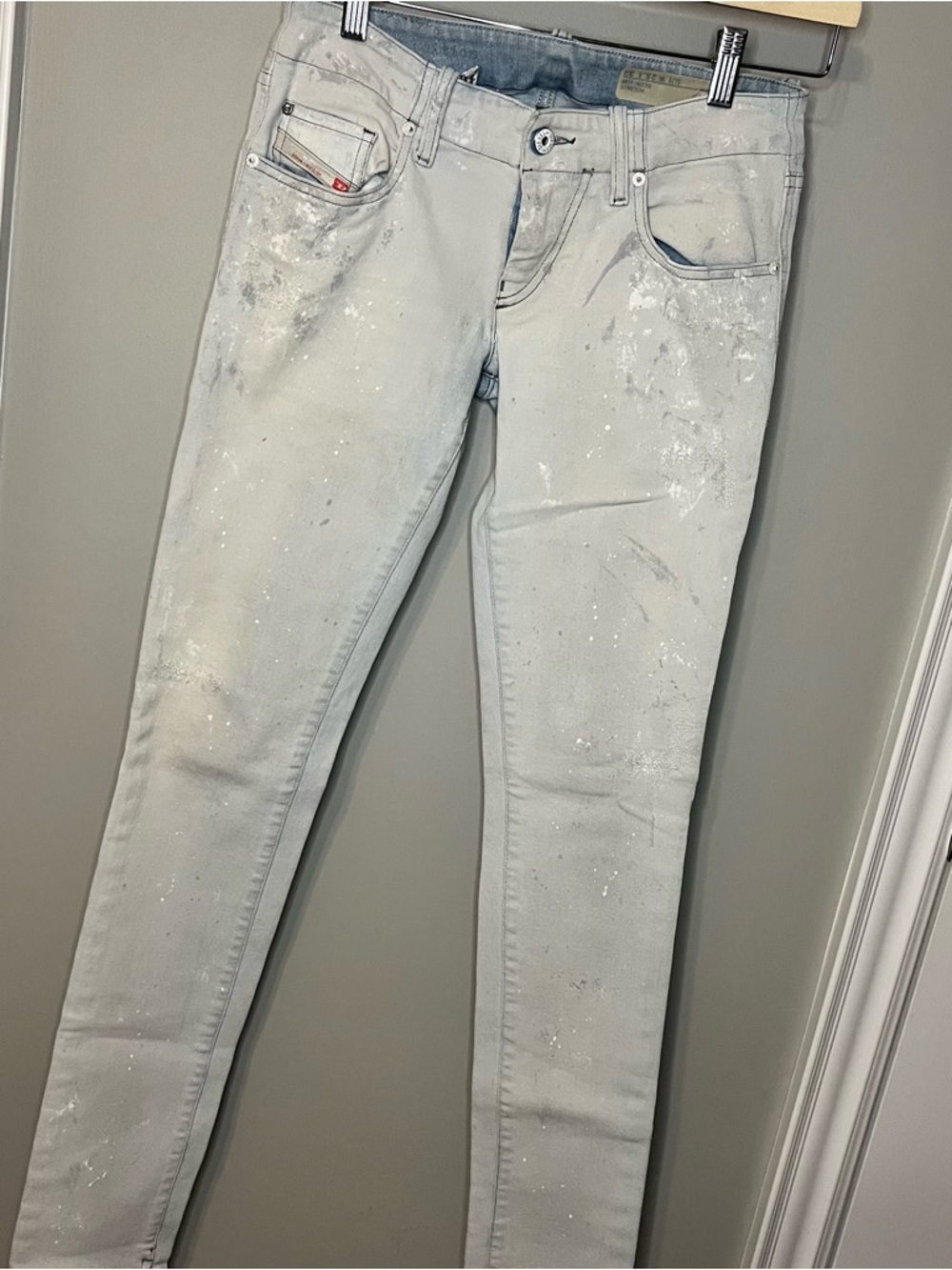 Light Blue Skinny Jeans with White Paint-Splatter Detail